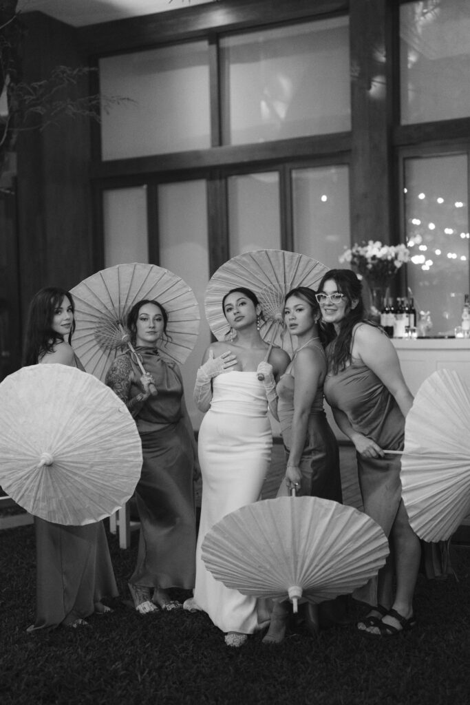 Phuket, Thailand destination bride and bridesmaids posing with parasols