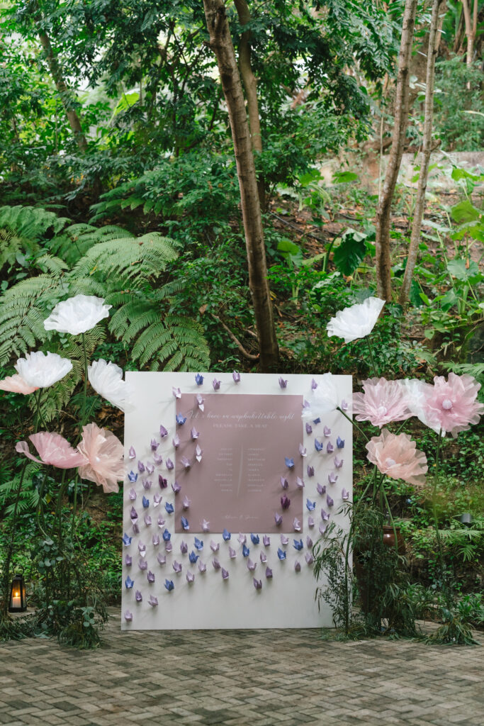 Thailand destination wedding seating chart decorated with paper cranes