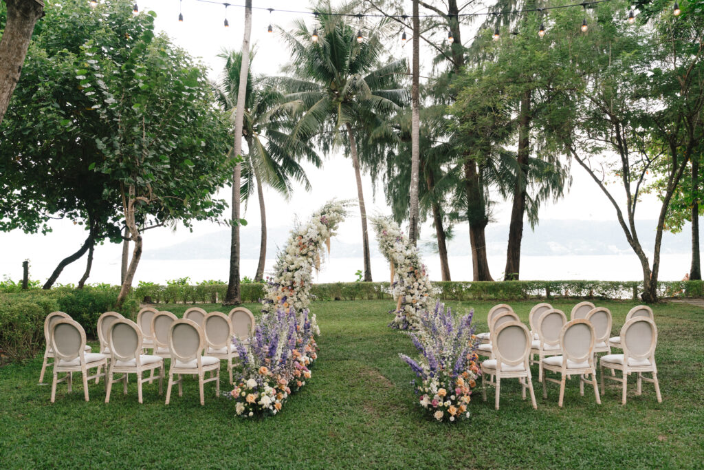 Thailand ceremony set-up with pastel-colored florals
