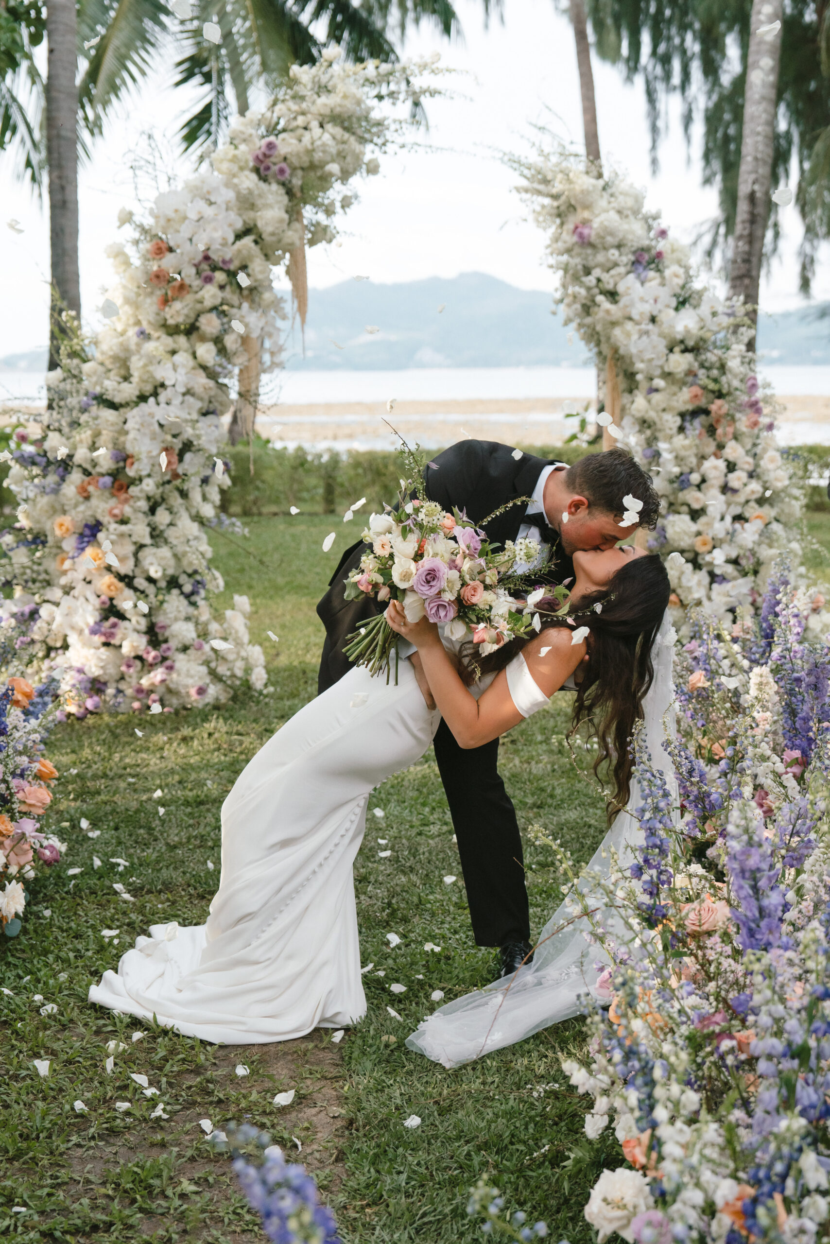 groom dipping bride for a kiss in Phuket, Thailand