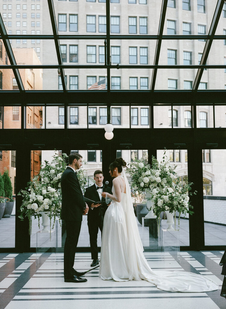 Bride and groom exchanging vows at Shinola Hotel