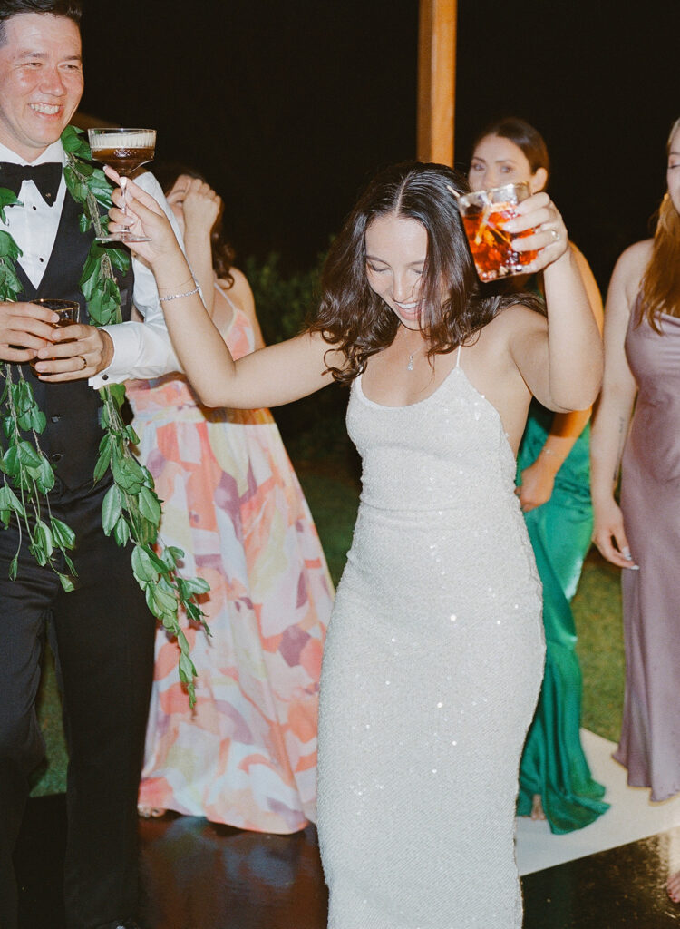 candid film photography of Oahu bride dancing during reception