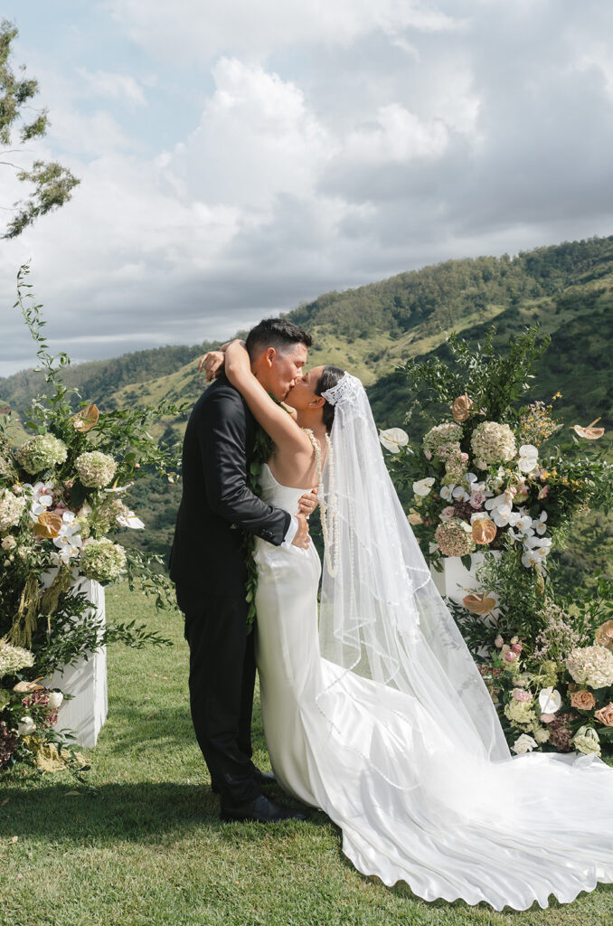 Bride and groom kidding in front of their ceremony location