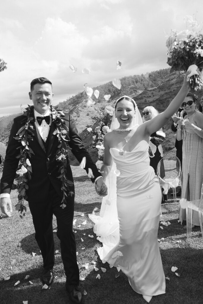 Bride and groom celebrating after Oahu wedding ceremony