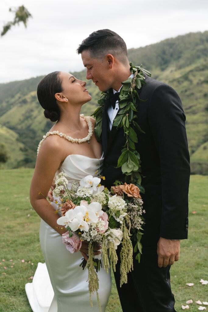 Bride and groom sharing a tender look during Oahu bridal portrait session