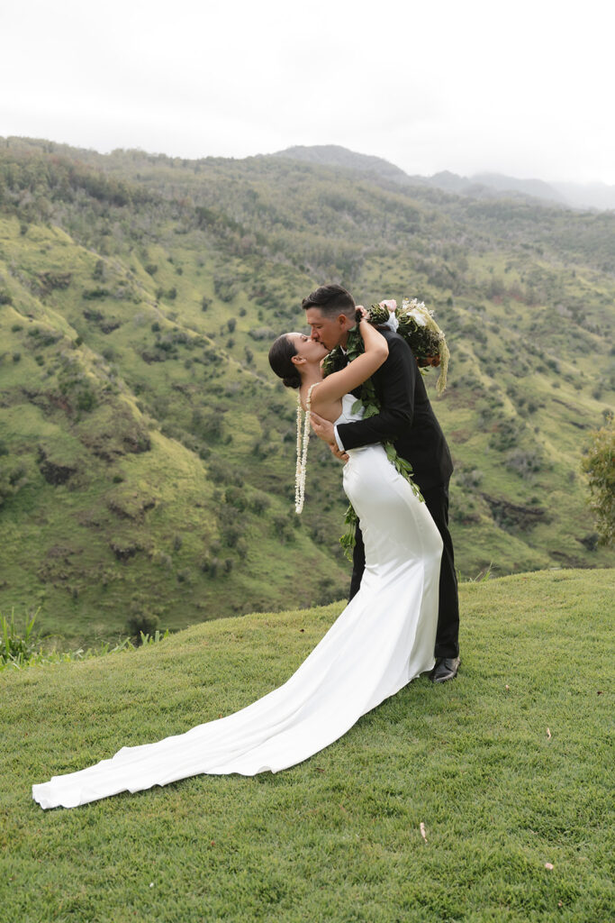 Bride and groom kissing during Oahu destination wedding photography portraits