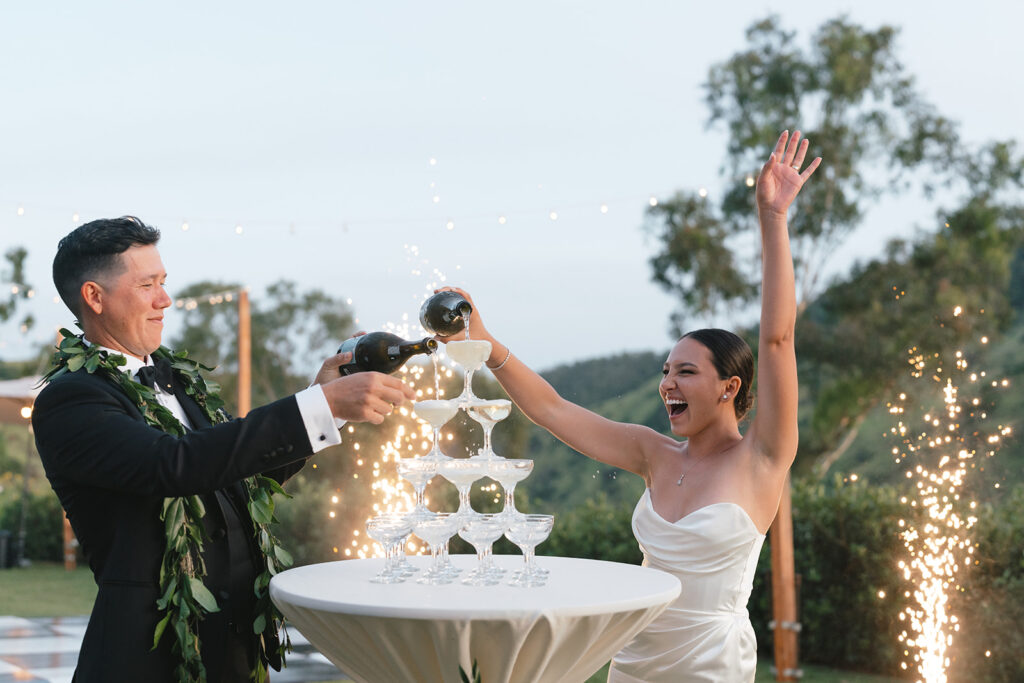 Oahu newlyweds kicking off reception with champagne tower