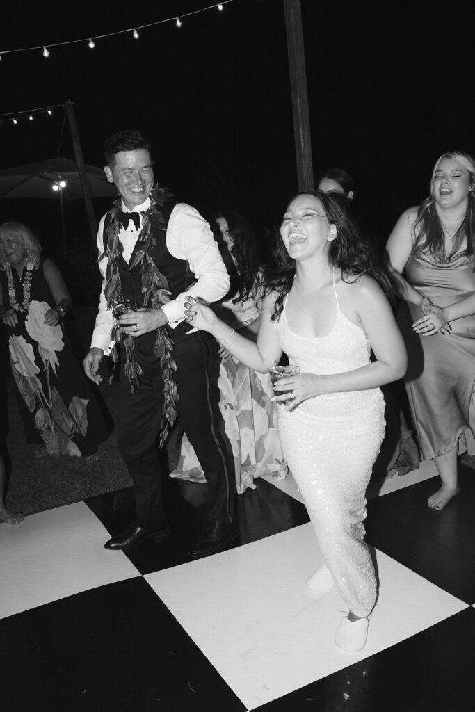 Candid shot of bride and groom dancing