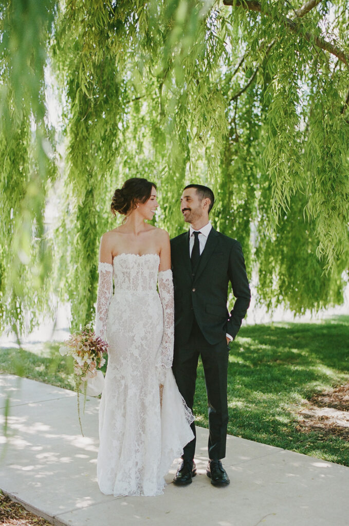 Bridal portrait under vibrant green foliage