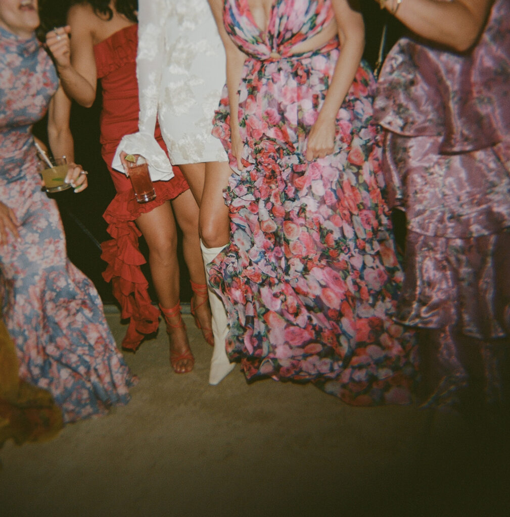 Colorful dresses at vibrant California wedding reception