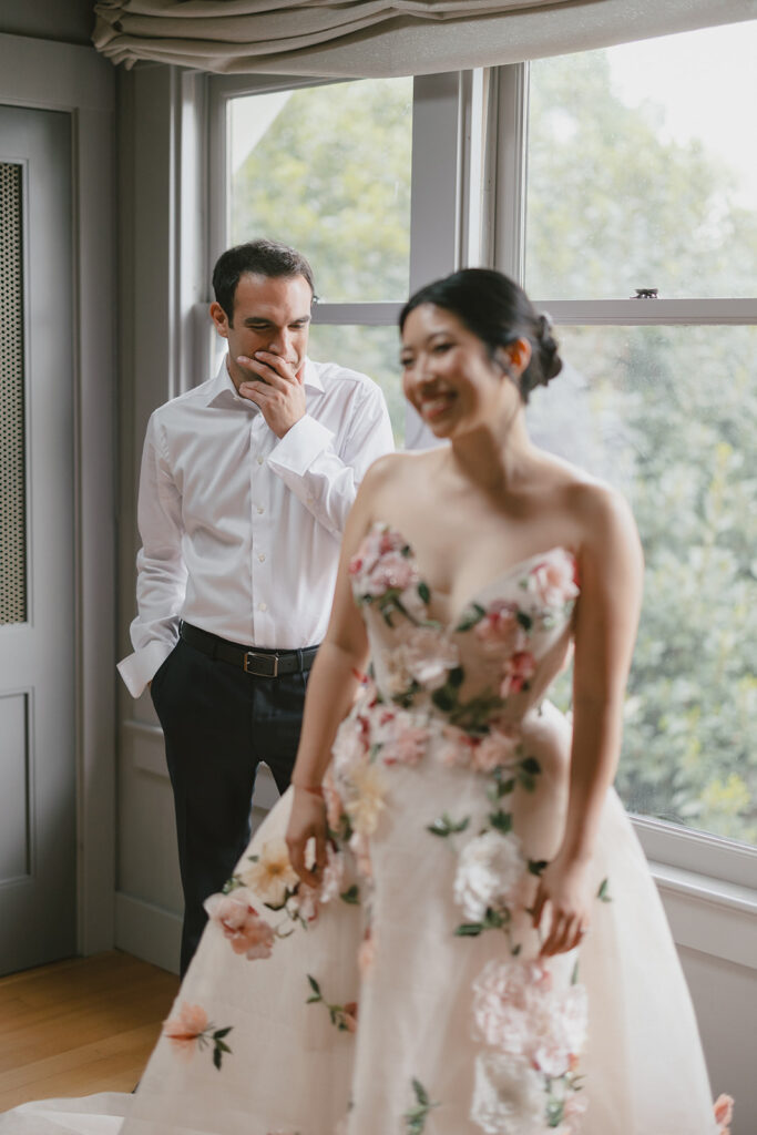 Groom admiring bride while getting ready for elevated Sonoma, CA, wedding