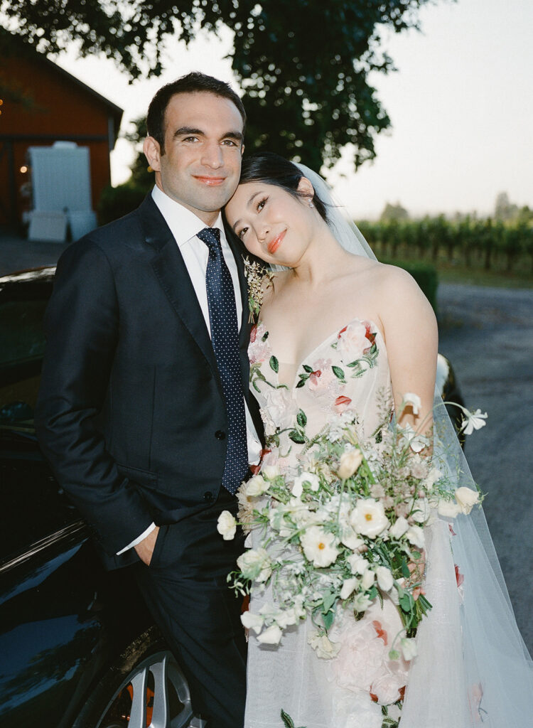 Stylized bridal portrait of bride resting head on groom's shoulder